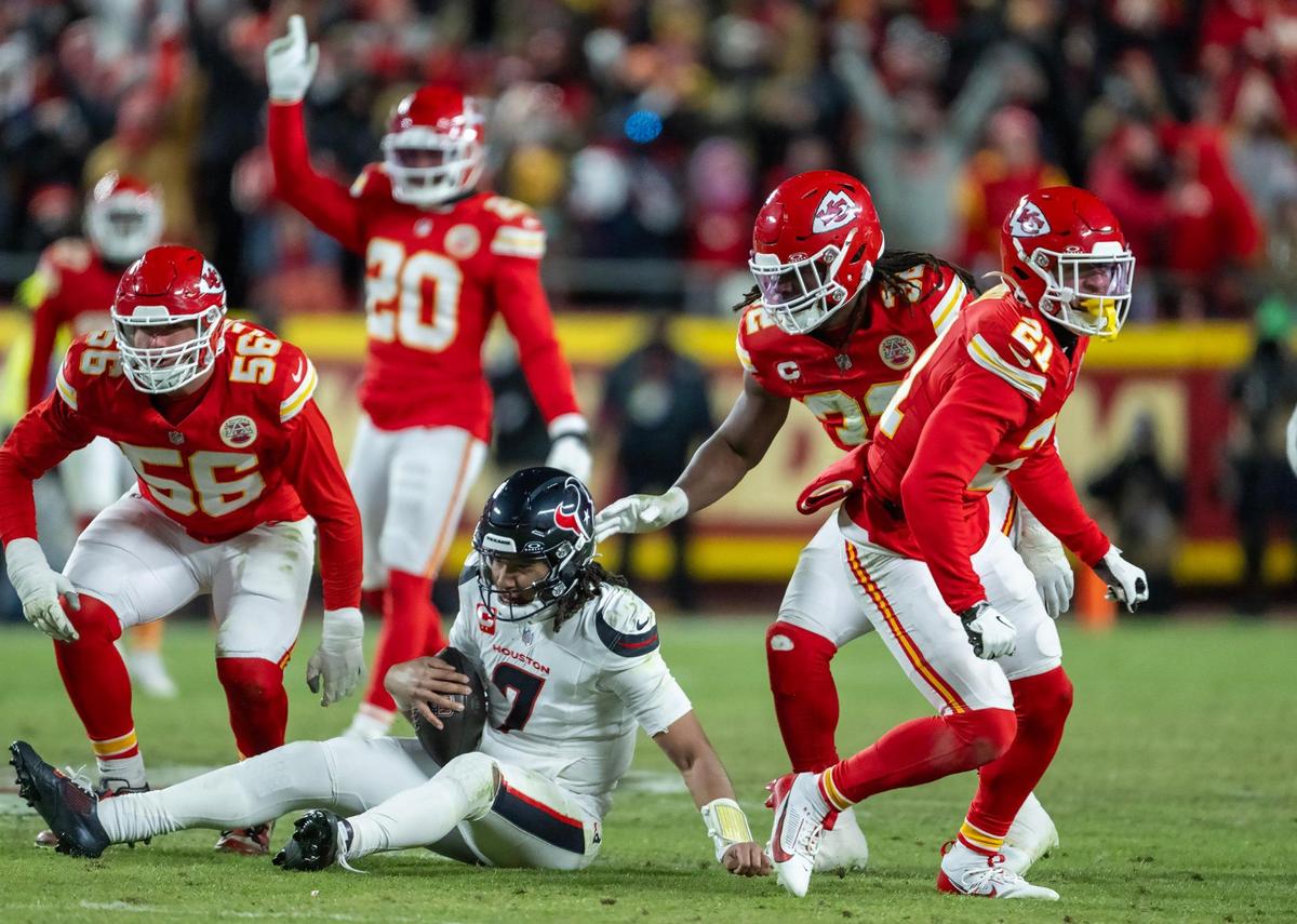 Kansas City Chiefs defensive end George Karlaftis (56) sacked Houston Texans quarterback C.J. Stroud (7) as Chiefs safety Jaden Hicks (21) Chiefs linebacker Nick Bolton (32) were in on the play in the second half of the AFC Divisional Round playoff game on Saturday, Jan. 18, 2025, at GEHA Field at Arrowhead Stadium. The Chiefs defeated the Texans 23-14.