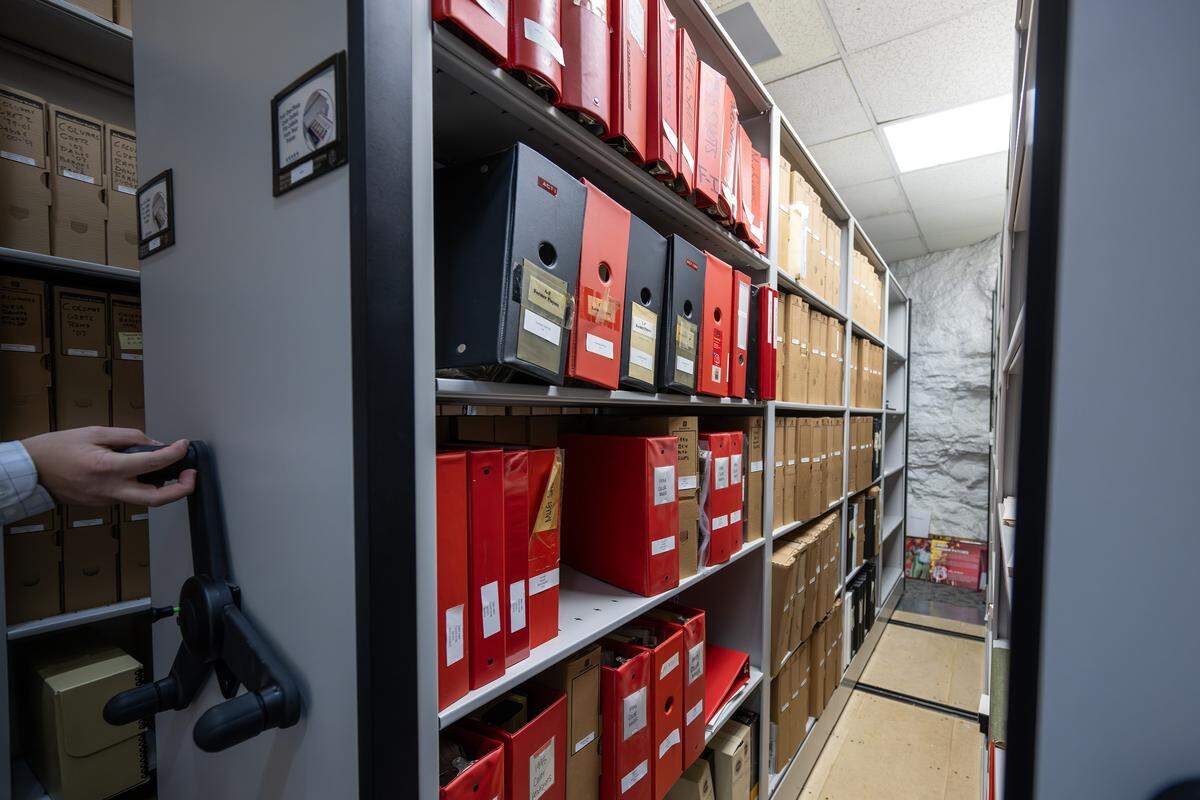 A collection of binders holding information about the Kansas City Chiefs is stored in the Rolling Rack Room inside the team’s underground storage facility in Kansas City.