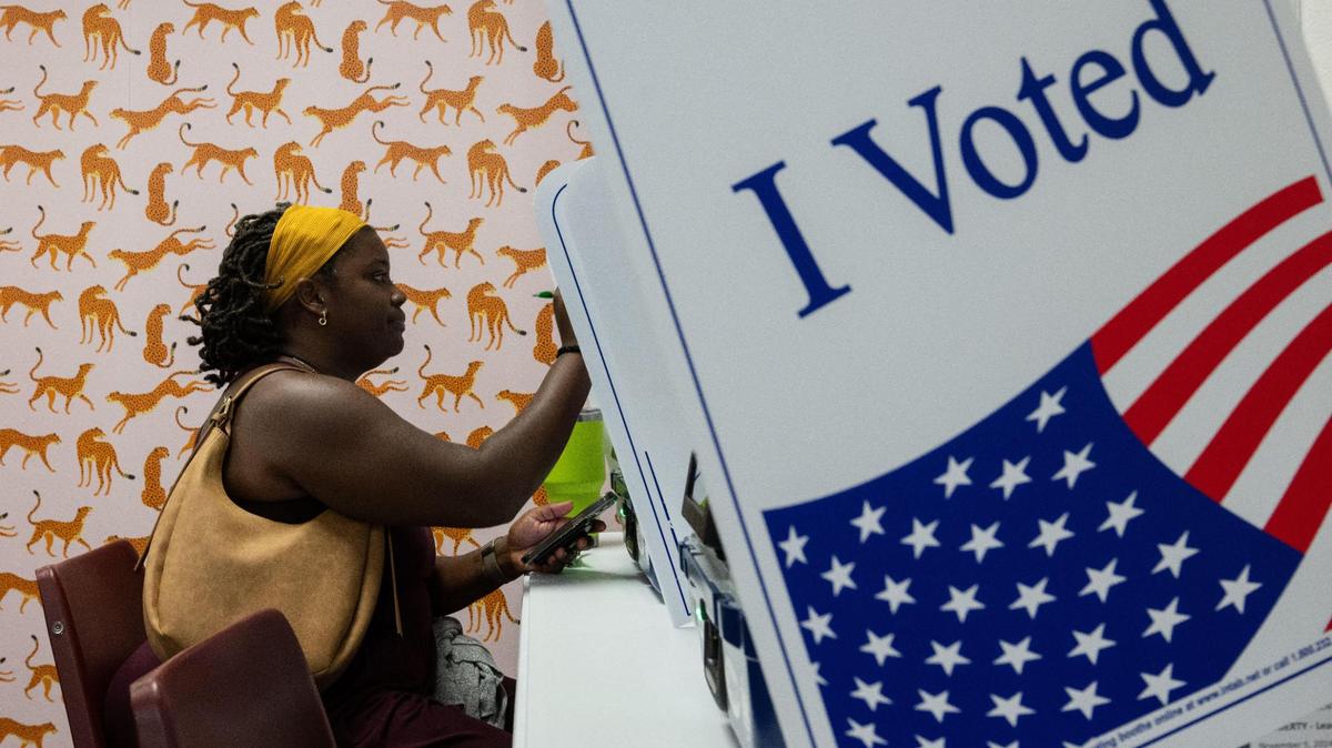 Erica Wilson of Lee’s Summit fills out out an electronic ballot during early voting at the Jackson County Election Board office polling station in Independence on Tuesday, Oct. 29.