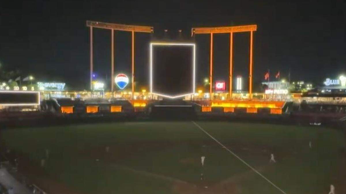 Most of the lights go out at Kauffman Stadium when relief pitcher Lucas Erceg enters a game.