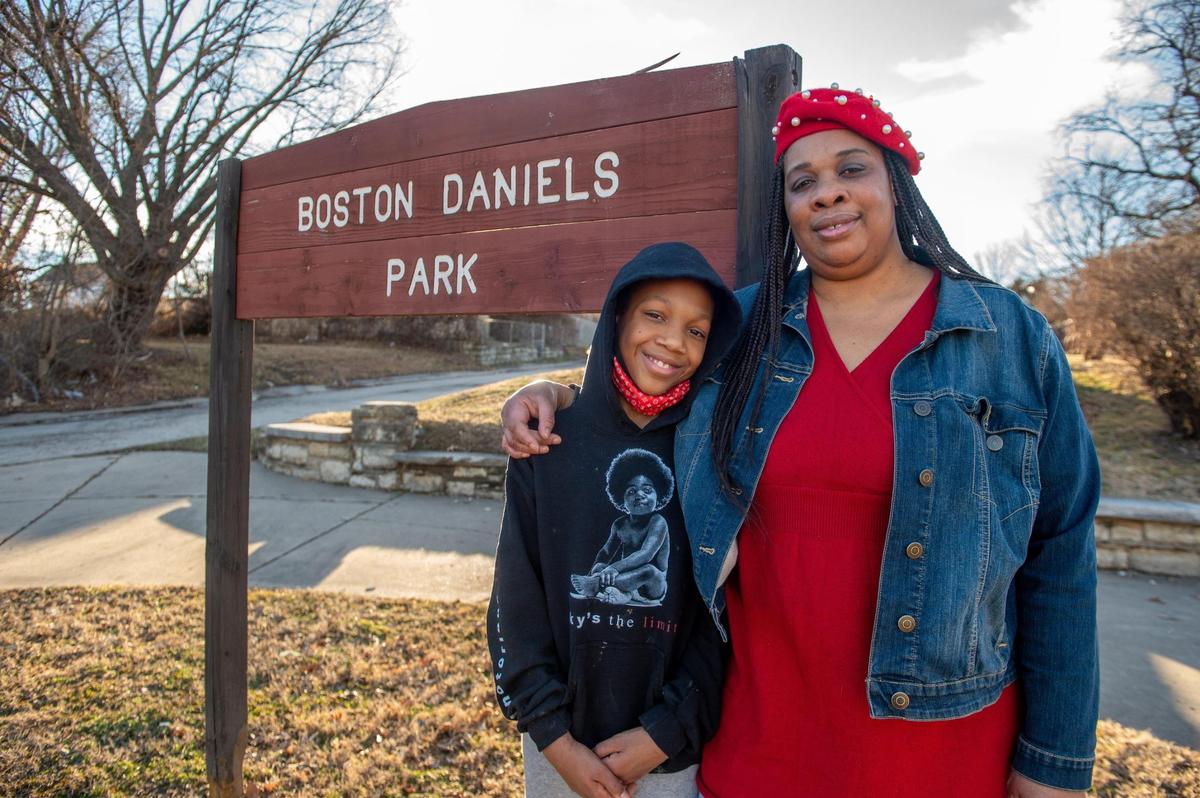 Karen Daniels, right, great niece of Boston Daniels, the first Black police chief of Kansas City, Kansas, stands in front of the Boston Daniels Park sign with her grandson King Tye. Daniels has advocated for years for renovation effort of the park that was named after her great uncle Boston Daniels, who became the city’s police chief in 1970. The park has deteriorated over the years since it was dedicated to Boston Daniels in 1996.