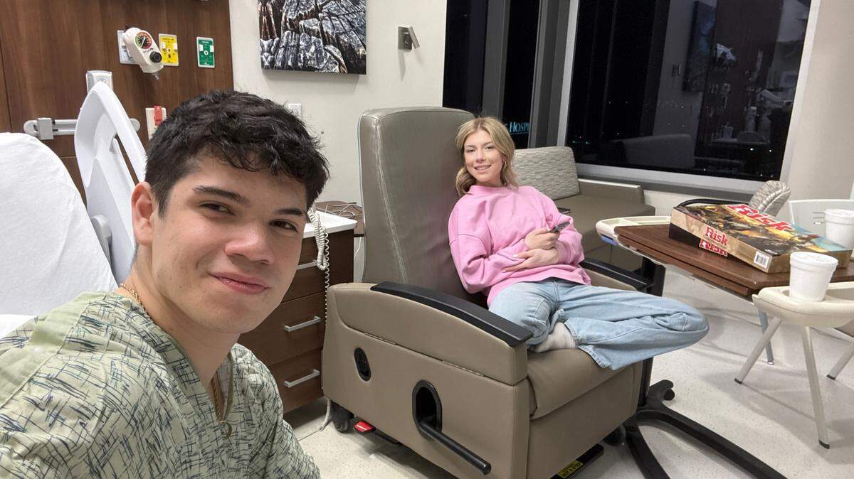 Nick Onnen and Samantha Tolman sit in a hospital room at University of Kansas Medical Center. Nick Onnen’s chemotherapy treatments usually take at least two hours.