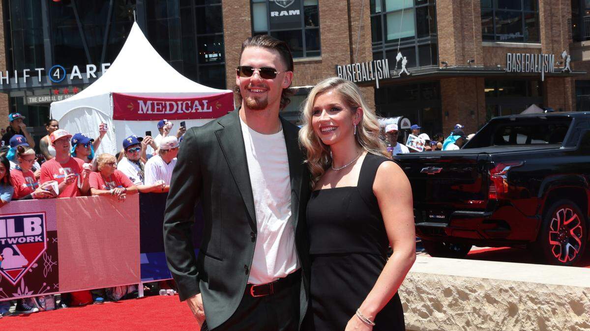 Maggie Witt, wife of Kansas City Royals shortstop Bobby Witt Jr., has created a collection of women’s workout apparel that launches April 20. The couple is seen here on the red carpet at the 2024 MLB All-Star game.
