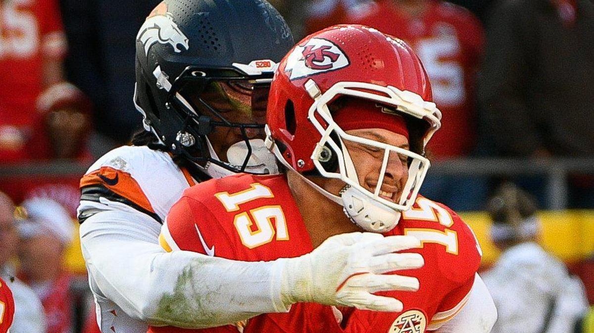 Kansas City Chiefs quarterback Patrick Mahomes (15) is sacked by Denver Broncos linebacker Nik Bonitto (15) in the second half on Sunday, Nov. 10, 2024, at GEHA Field at Arrowhead Stadium.