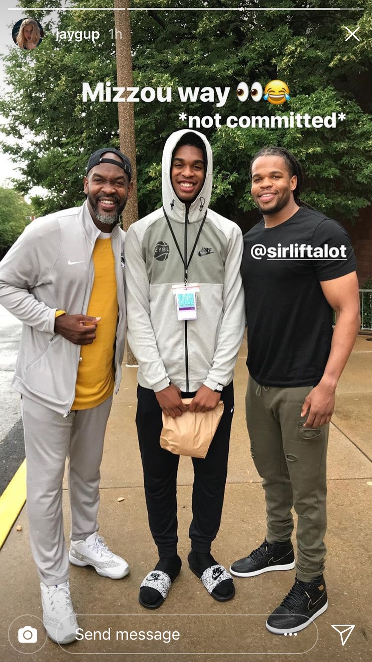 Missouri target Josh Christopher (center), poses with his father, Laron (left), and cousin Nicodemus (right) outside of the SLU recreation center. Nicodemus is Missouri's strength coach and the Tigers have offered Josh a scholarship. Per NCAA rules, Nicodemus was not allowed to watch the camp, despite being family.