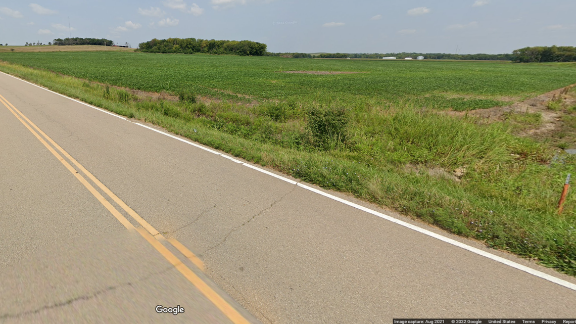 As the woman was walking along the road west of Topeka, a person spotted her and called for help, authorities said.