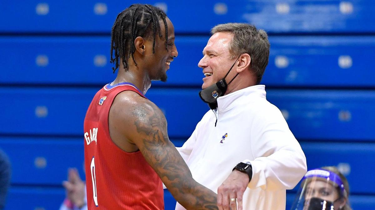 KU senior Marcus Garrett, left, gets a hug from Kansas coach Bill Self and a standing ovation from the fans in the closing seconds of the Jayhawks’ late-February win over Baylor.