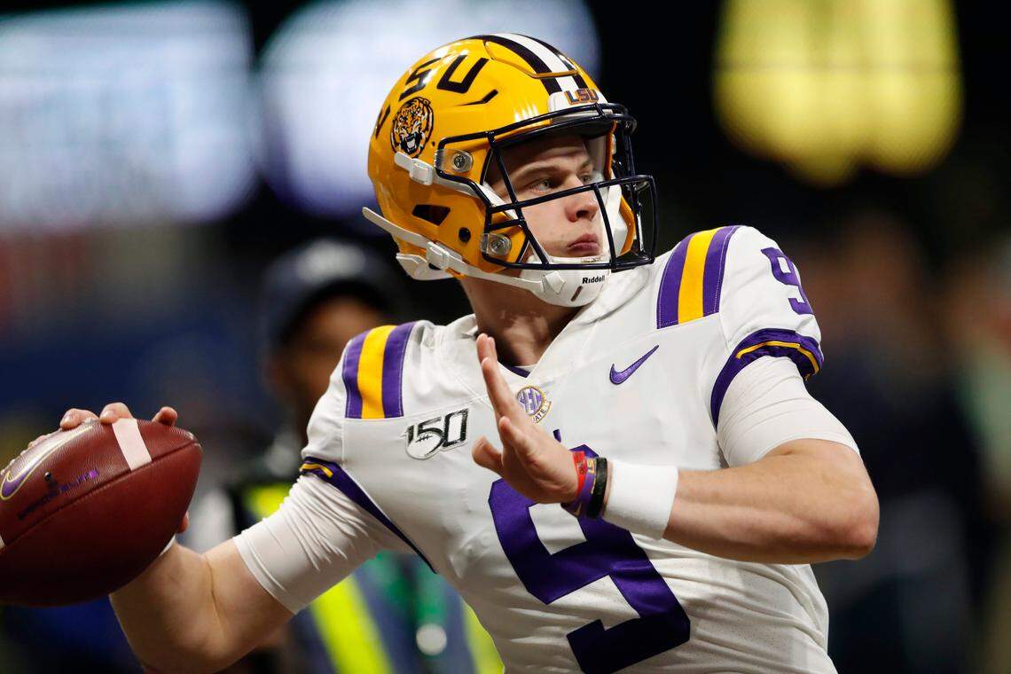 FILE - In this Dec. 7, 2019, file photo, LSU quarterback Joe Burrow (9) warms up before the Southeastern Conference championship NCAA college football game against Georgia, in Atlanta. Burrow is a unanimous selection as the offensive player of the year on The Associated Press All-Southeastern Conference football team, Monday, Dec. 9, 2019.(AP Photo/John Bazemore, File)