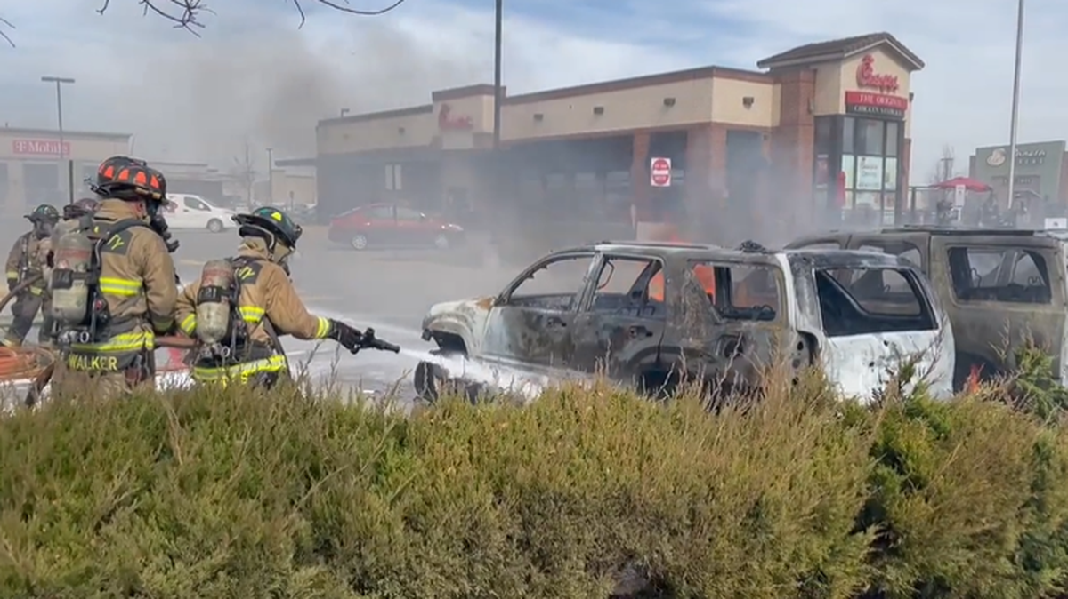 A grass fire spread to a Chick-fil-A parking lot in Oklahoma City, officials say.