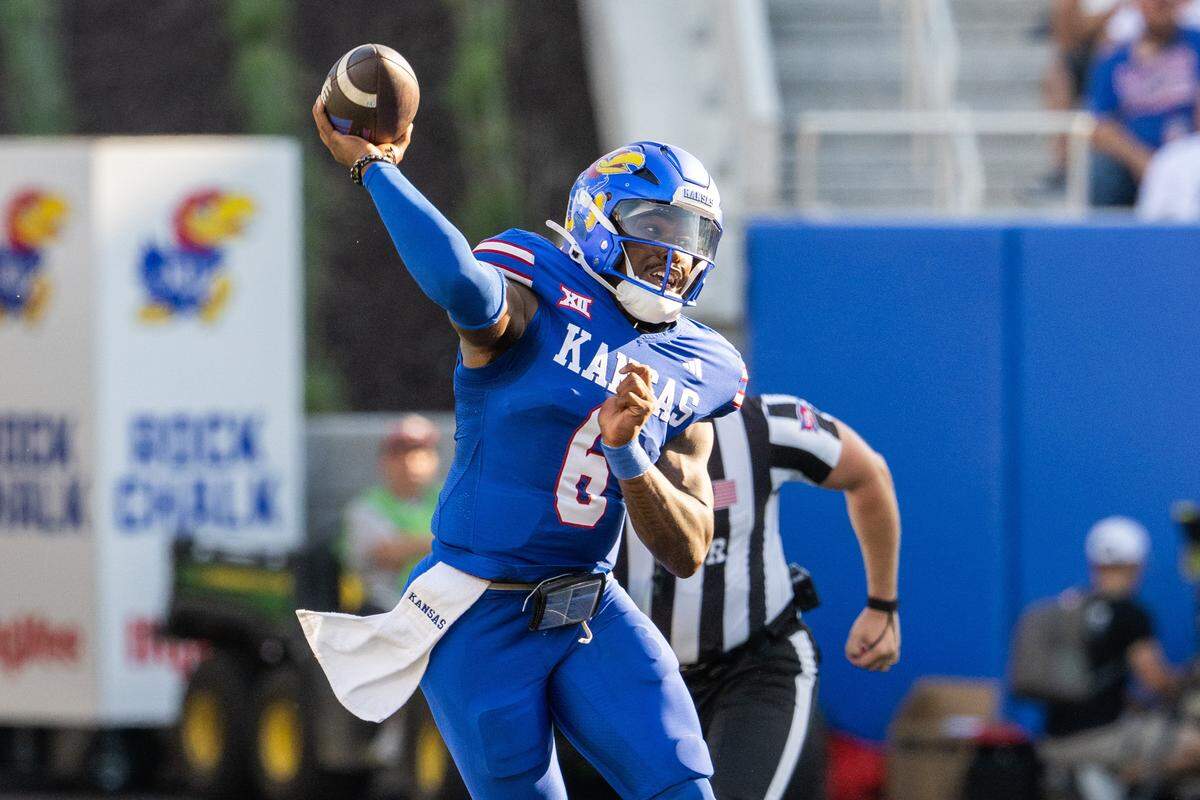 Kansas Jayhawks quarterback Jalon Daniels (6) throws a jump pass in the first half of the Jayhawks game vs. the Fresno State Bulldogs on Saturday, Aug. 23, 2025, at David Booth Kansas Memorial Stadium, in Lawrence.