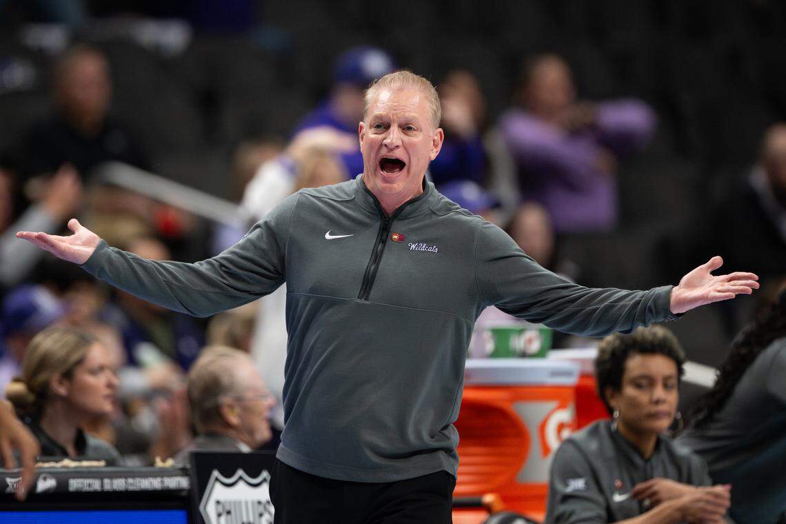 Kansas State Wildcats head coach Jeff Mittie throws his arms out in disbelief at a no-call against Oklahoma State during the Big 12 Women’s Basketball Tournament at the T-Mobile Center.