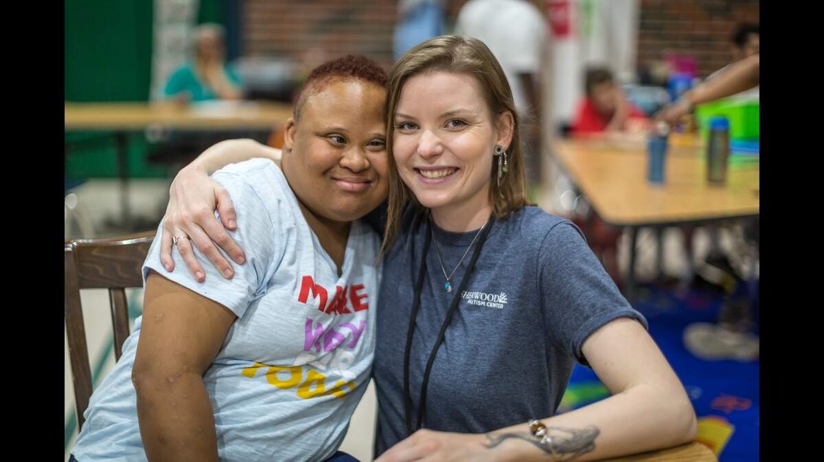 Special education teacher Kara Resseguie, right, and student Tareah at the Sherwood Autism Center.
