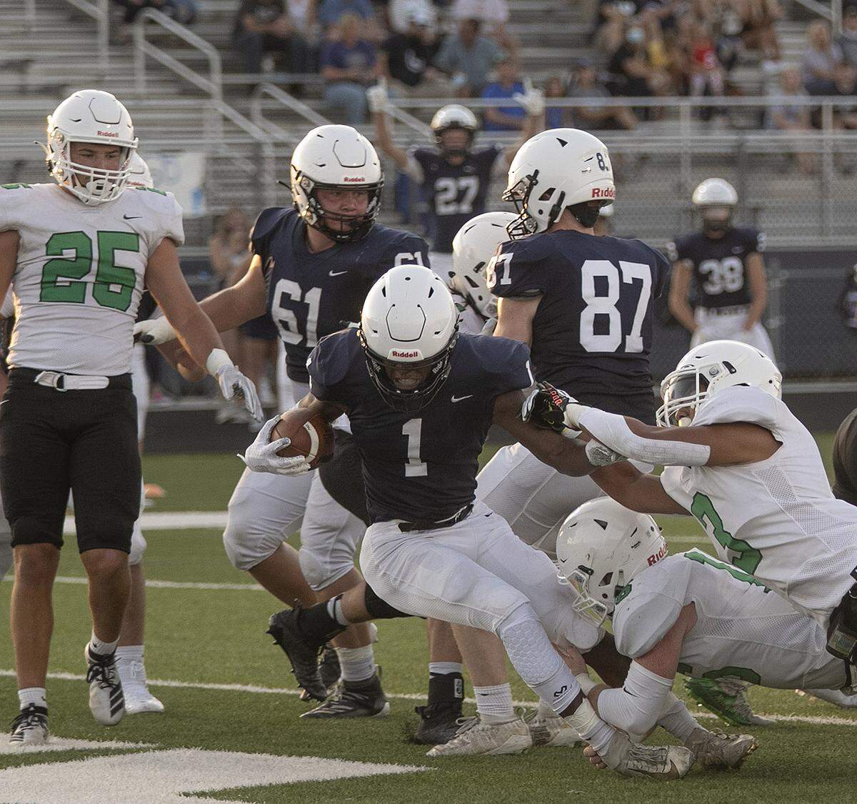 Mill Valley’s Quin Wittenauer was brought down by Amare Ramirez of Derby on Friday, September 4, 2020 at Mill Valley.