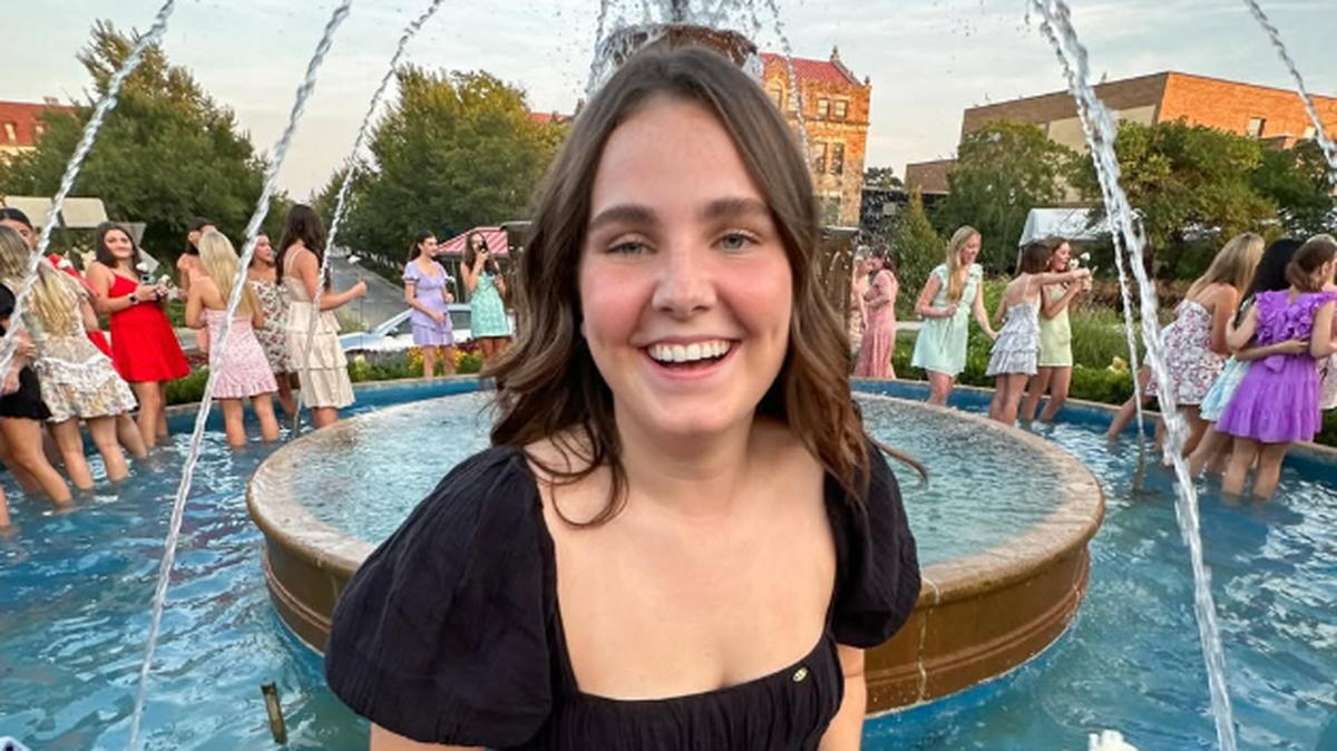 Elsa McGrain, seen here standing in a water fountain. McGrain, a 20 year old University of Kansas student set to graduate in 2026, was killed in a hit-and-run crash in Lawrence Thursday while out jogging.