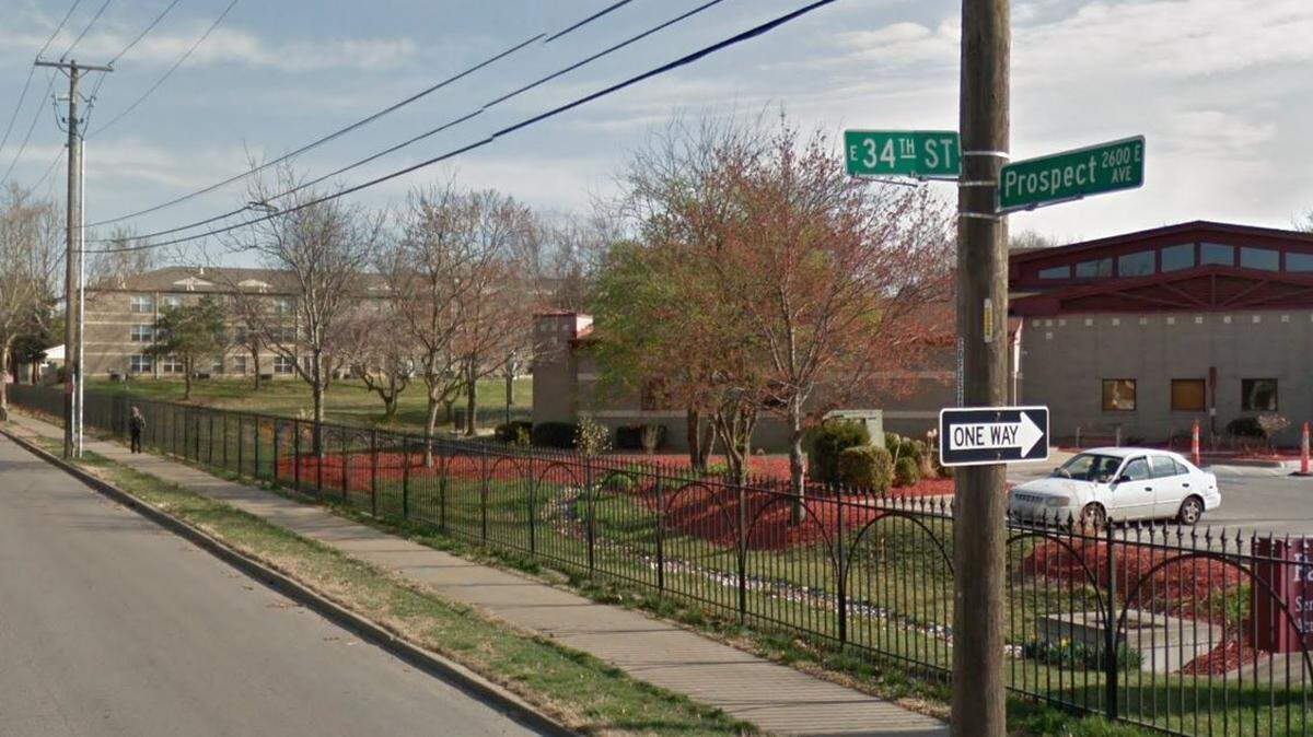 Kansas City police are searching for the driver of a black SUV who fled after crashing into a red scooter on May 30, 2022, in the area of East 34th Street and Prospect Avenue. A Google Maps street view image from March 2017 shows the general area.