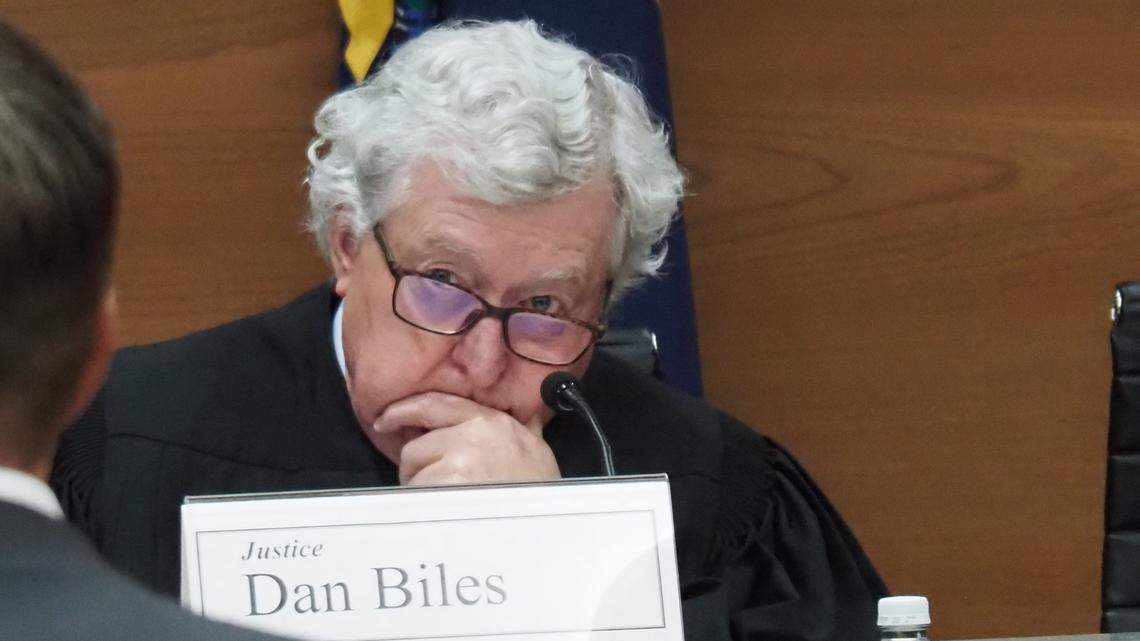 Supreme Court Justice Dan Biles listens to oral arguments over Kansas election laws.