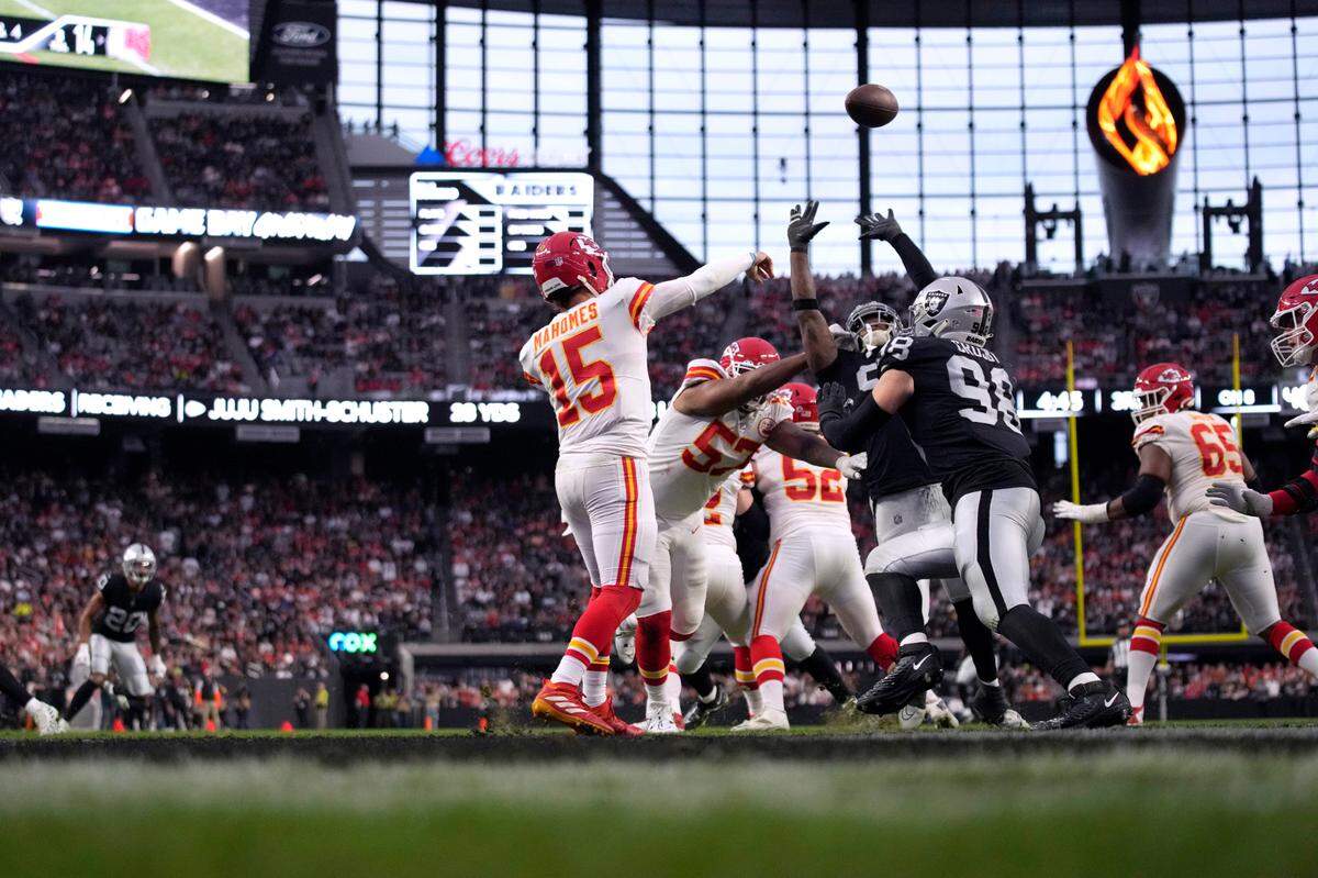 Kansas City Chiefs quarterback Patrick Mahomes (15) throws during the first half of an NFL football game against the Las Vegas Raiders Saturday, Jan. 7, 2023, in Las Vegas.