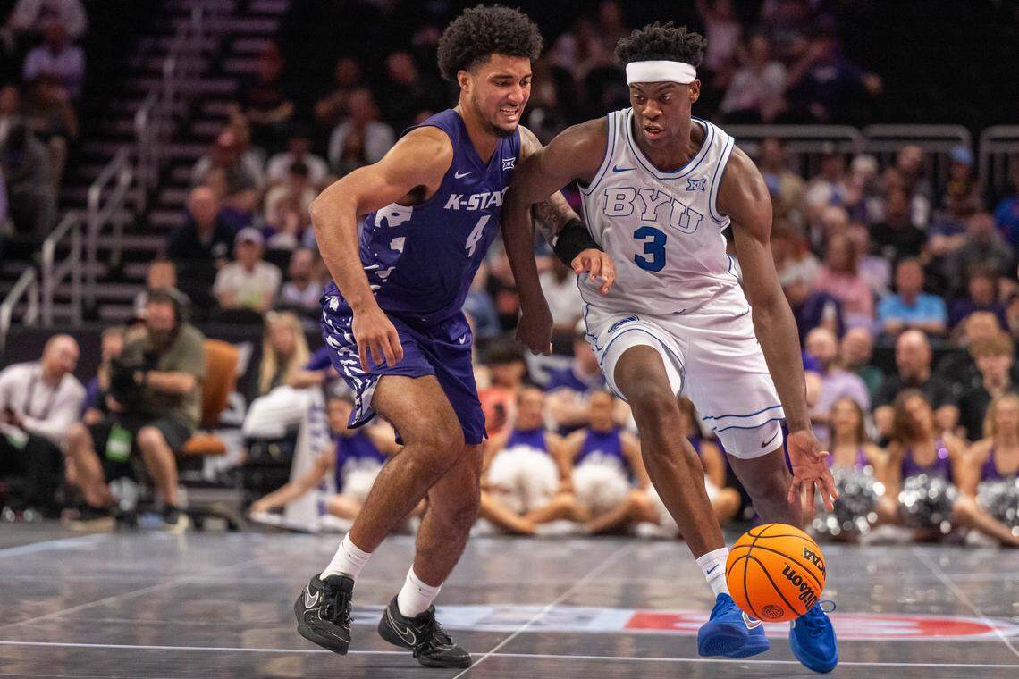 BYU Cougars forward AJ Dybantsa dribbles the ball up the court against Kansas State Wildcats guard PJ Haggerty (4) in the second half of the Wildcats first round game vs. the BYU Cougars in the Big 12 Men's Basketball Tournament, on Tuesday, March 10, 2026, at T-Mobile Center. The Wildcats lost to BYU, 105-91.