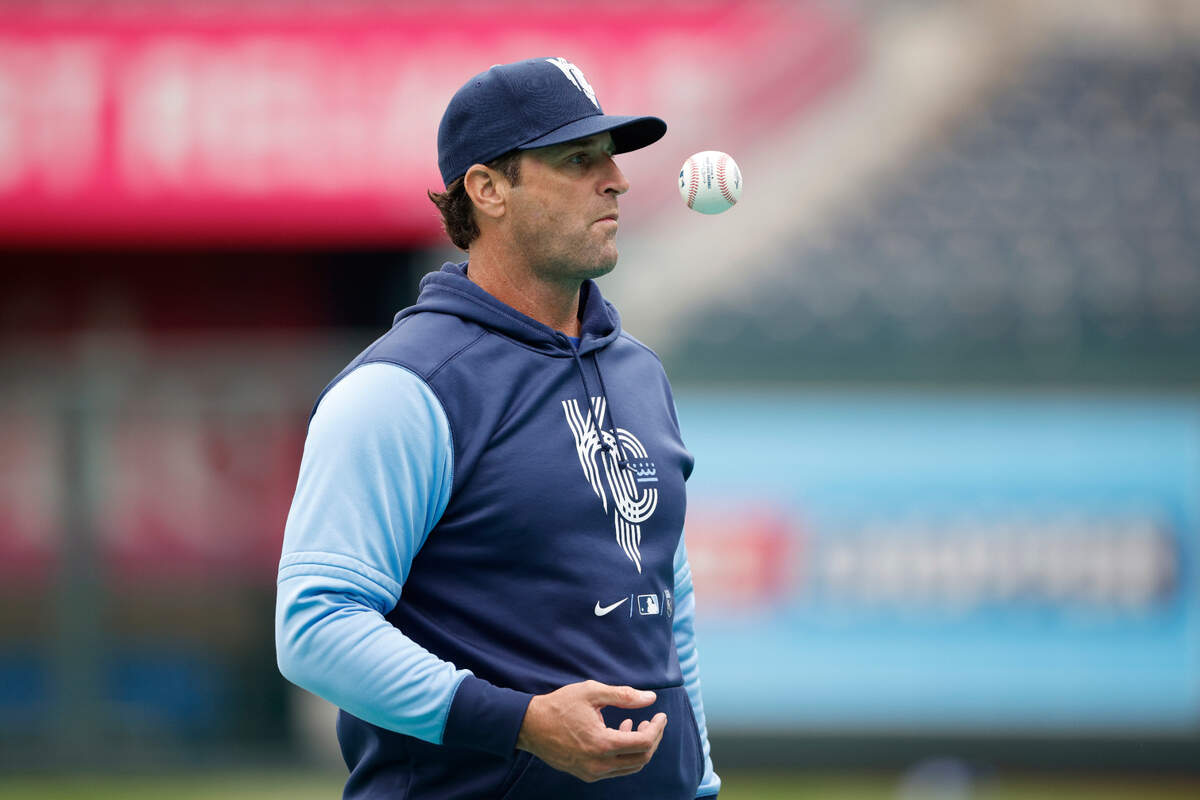 Kansas City Royals manager Mike Matheny waits for the next player to enter the cage as he pitches batting practice before a baseball game against the St. Louis Cardinals in Kansas City, Mo., Tuesday, May 3, 2022.