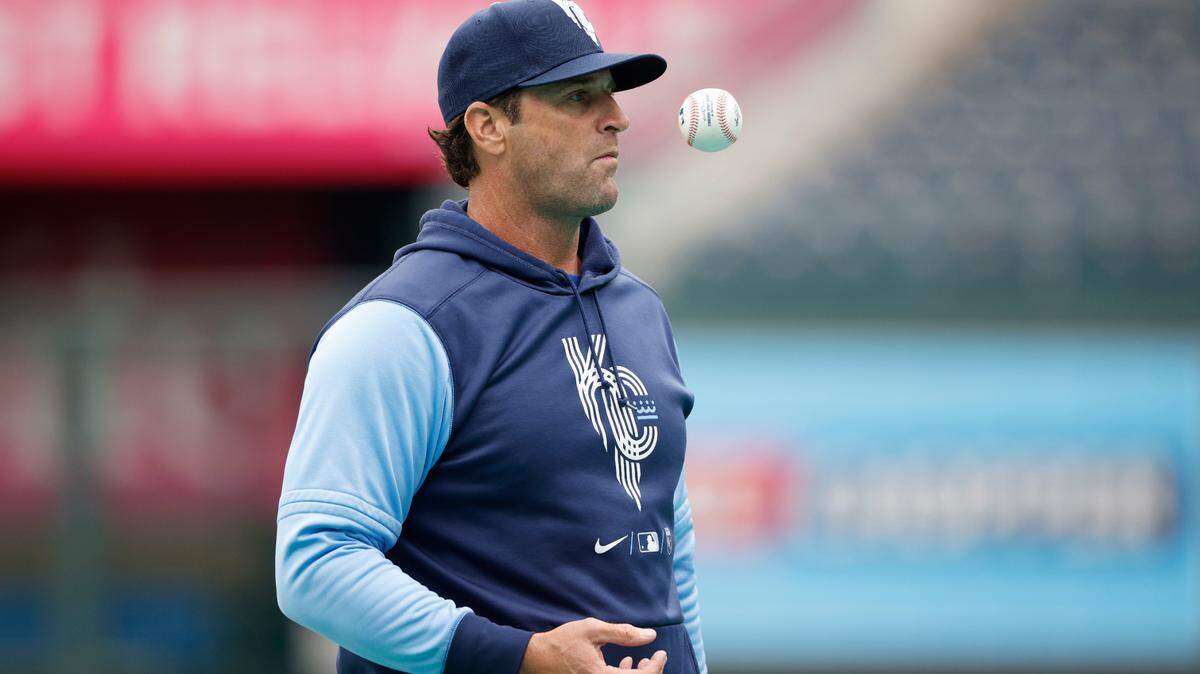 Kansas City Royals manager Mike Matheny waits for the next player to enter the cage as he pitches batting practice before a baseball game against the St. Louis Cardinals in Kansas City, Mo., Tuesday, May 3, 2022.