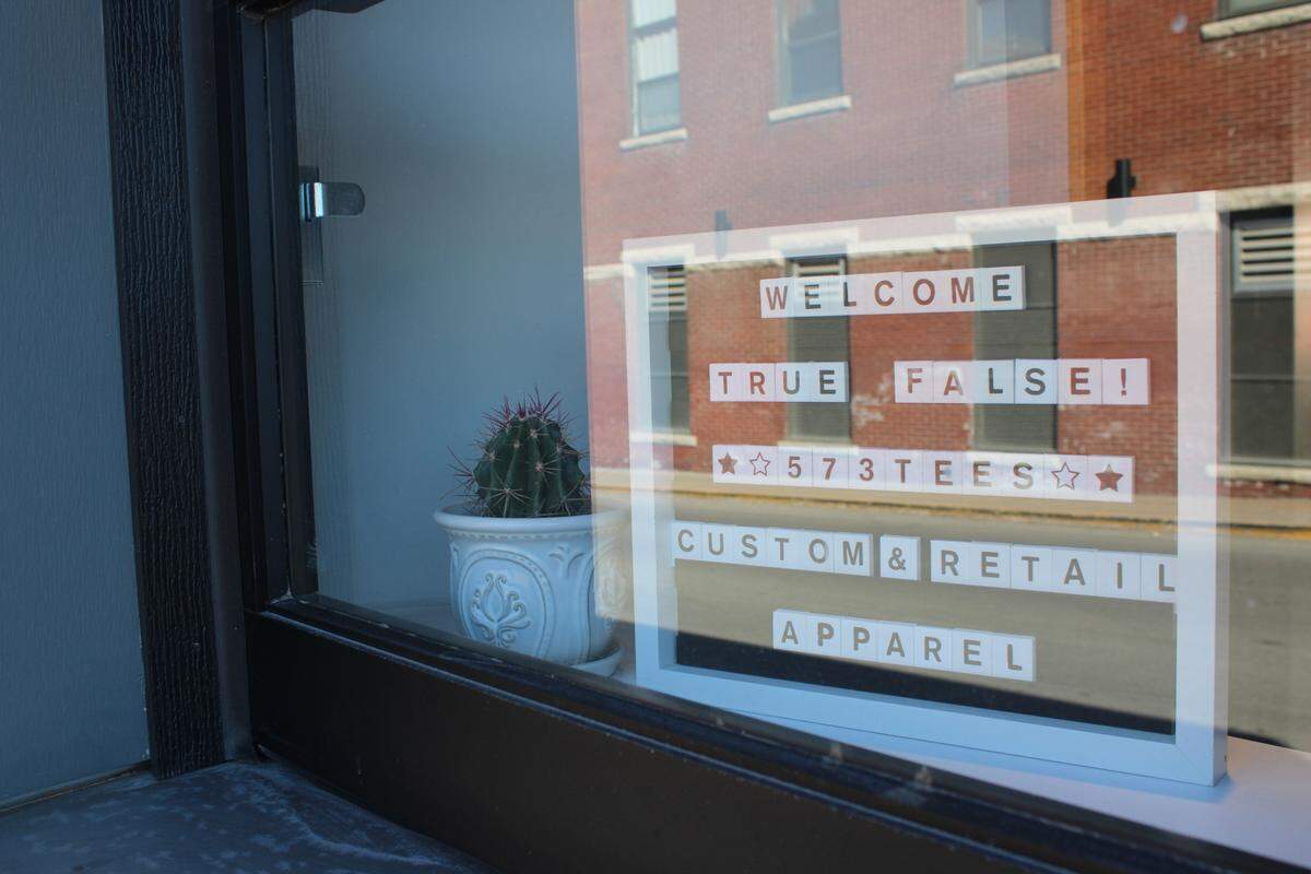 In the window of 573 Tees, on Hitt Street in Columbia, a sign says, “Welcome True/False!” Several other businesses downtown displayed similar messages.