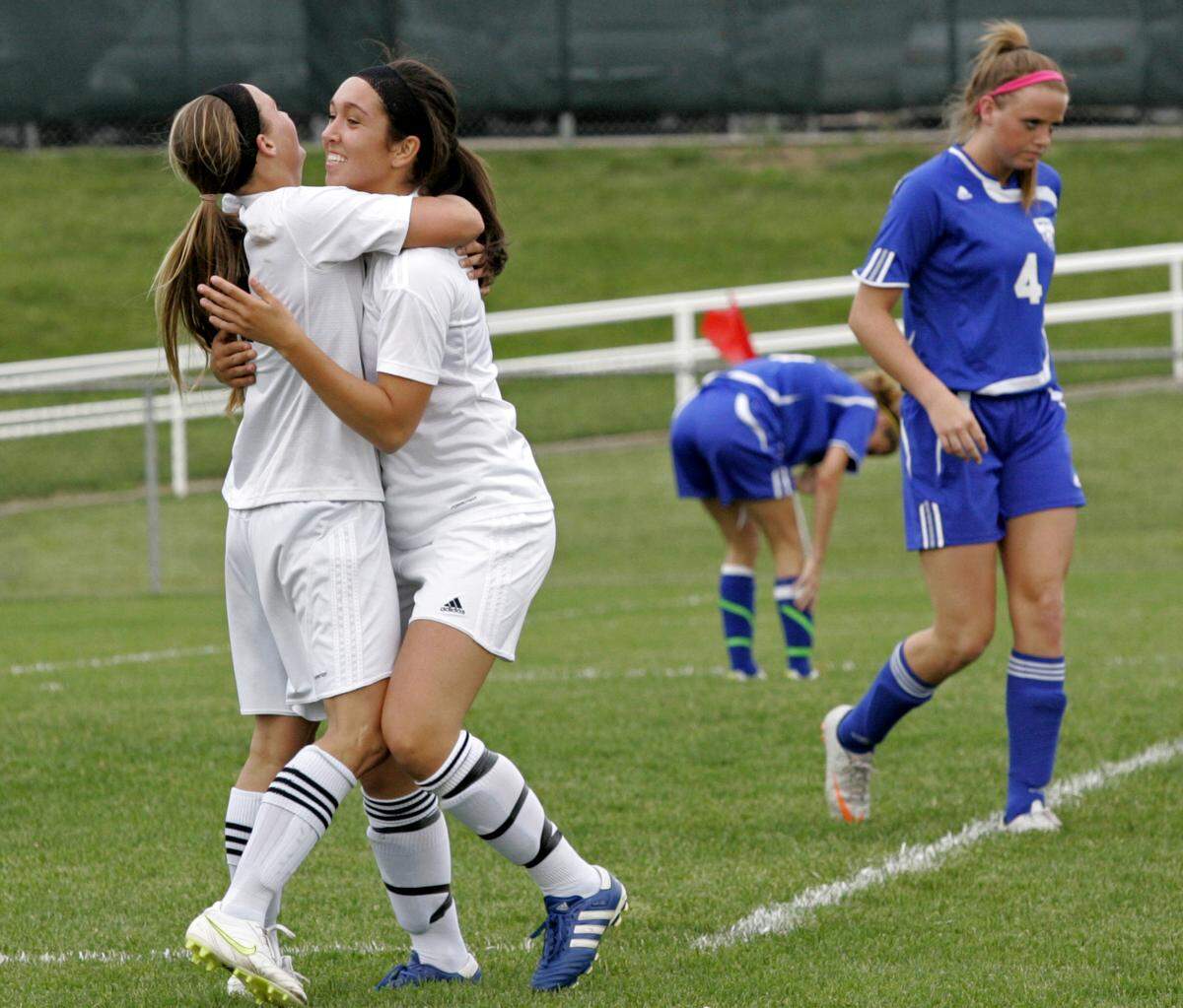 Shawnee Mission West’s Sydney Miramontez, right, hugged teammate Amy Schmidt after the pair combined for a goal during the Kansas Class 6A state quarterfinals in May 2011 at the Shawnee Mission Athletic Complex.
