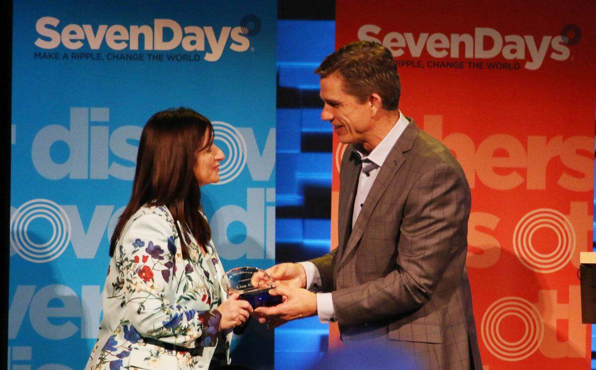 Lisa Ginter, CEO of CommunityAmerica Credit Union, receives the Ripple of Kindness award last year from Trent Green at the SevenDays kindness breakfast at Church of the Resurrection. This year’s recipient will receive the award at an April 10 breakfast.