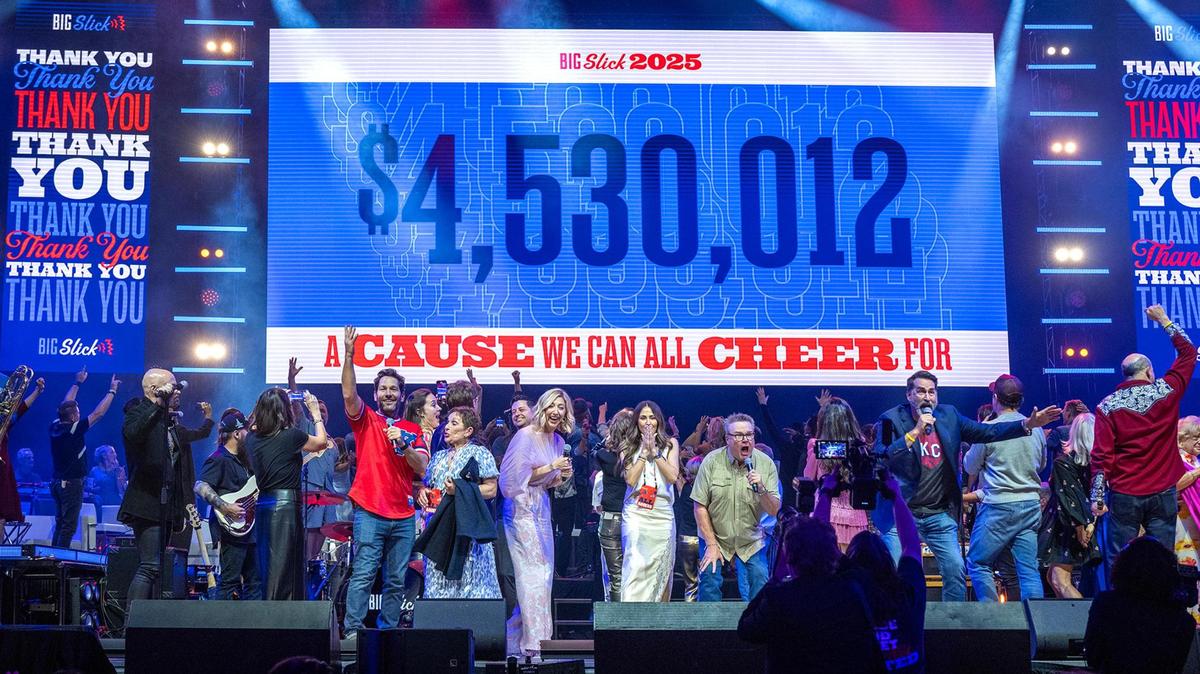 Hosts of the Big Slick Show including Paul Rudd, from left, Heidi Gardner, Eric Stonestreet, Rob Riggle and David Koechner on stage announcing they raised $4.5 million on the big screen on Saturday, May 31, 2025, at the T-Mobile Center in Kansas City. The proceeds benefit pediatric cancer at Children’s Mercy Hospital.