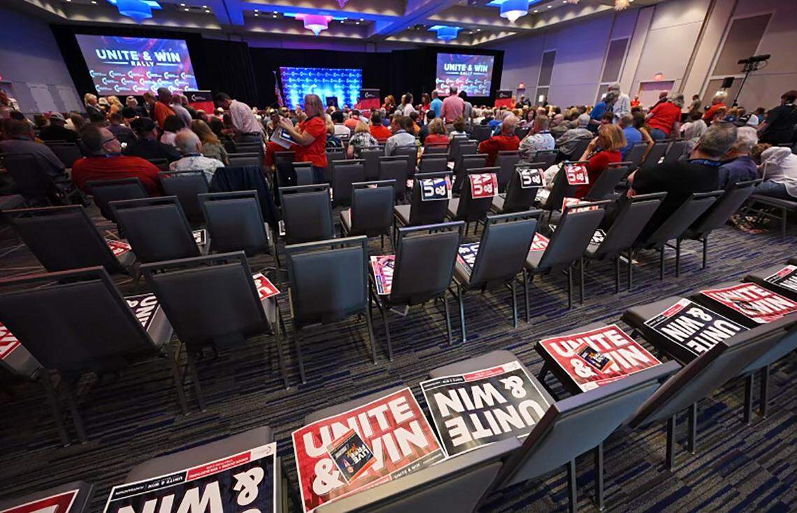 As protesters gathered outside, supporters of Florida Gov. Ron DeSantis and Attorney General Derek Schmidt prepared for a rally at Embassy Suites in Olathe as part of Schmidt’s GOP campaign for Kansas governor.