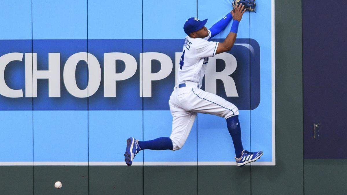 Kansas City Royals right fielder Edward Olivares can’t make the catch on a ball hit Cleveland Indians’ Amed Rosario for an inside-the-park home run during the first inning of a baseball game Tuesday, Aug. 31, 2021, in Kansas City, Mo. (AP Photo/Reed Hoffmann)
