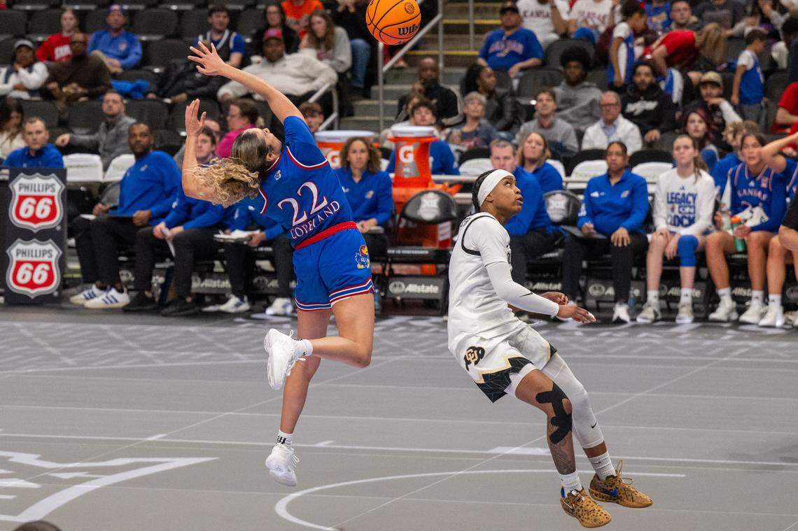 Kansas Jayhawks guard Sania Copeland (22) has the ball stripped by Colorado Buffaloes guard Zyanna Walker (1) on a fast break in the second half of the KU’s second-round game at the Big 12 Women's Basketball Tournament on Thursday, March 5, 2026, at T-Mobile Center in Kansas City.