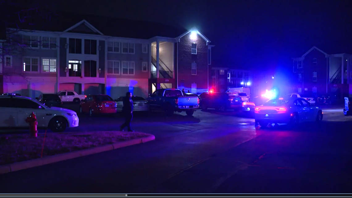 A man kicking in an apartment door was fatally shot, police said.