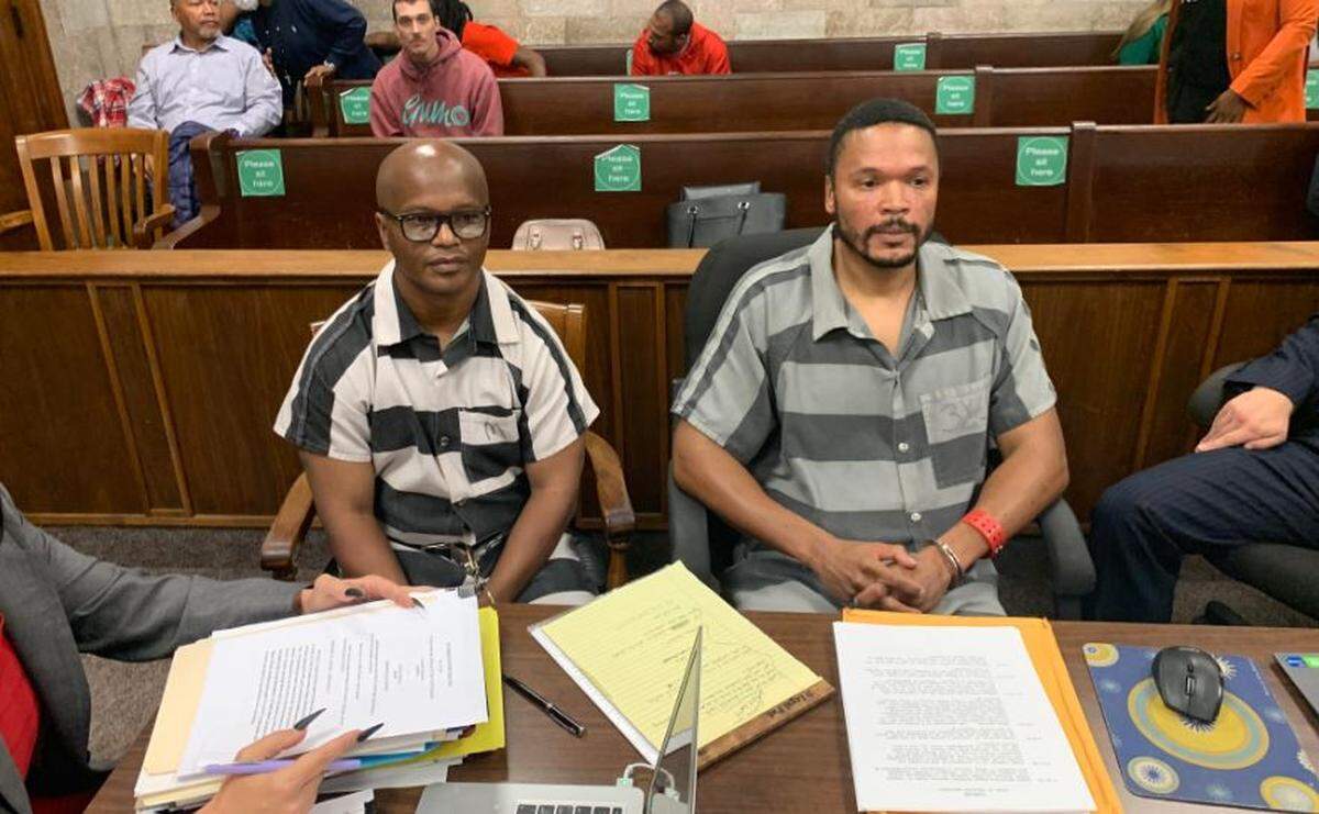 Celester McKinney, left, and Brian Betts, right, sit with their attorneys during an evidentiary hearing Oct. 25, 2022, at the Wyandotte County courthouse in Kansas City, Kansas.
