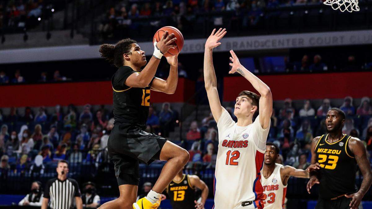 Mizzou guard Dru Smith (12) goes up for a layup against the Florida Gators at Exactech Arena in Gainesville on Wednesday, March 3, 2021. Smith later won the game for the Tigers with a driving basket in the 72-70 victory.