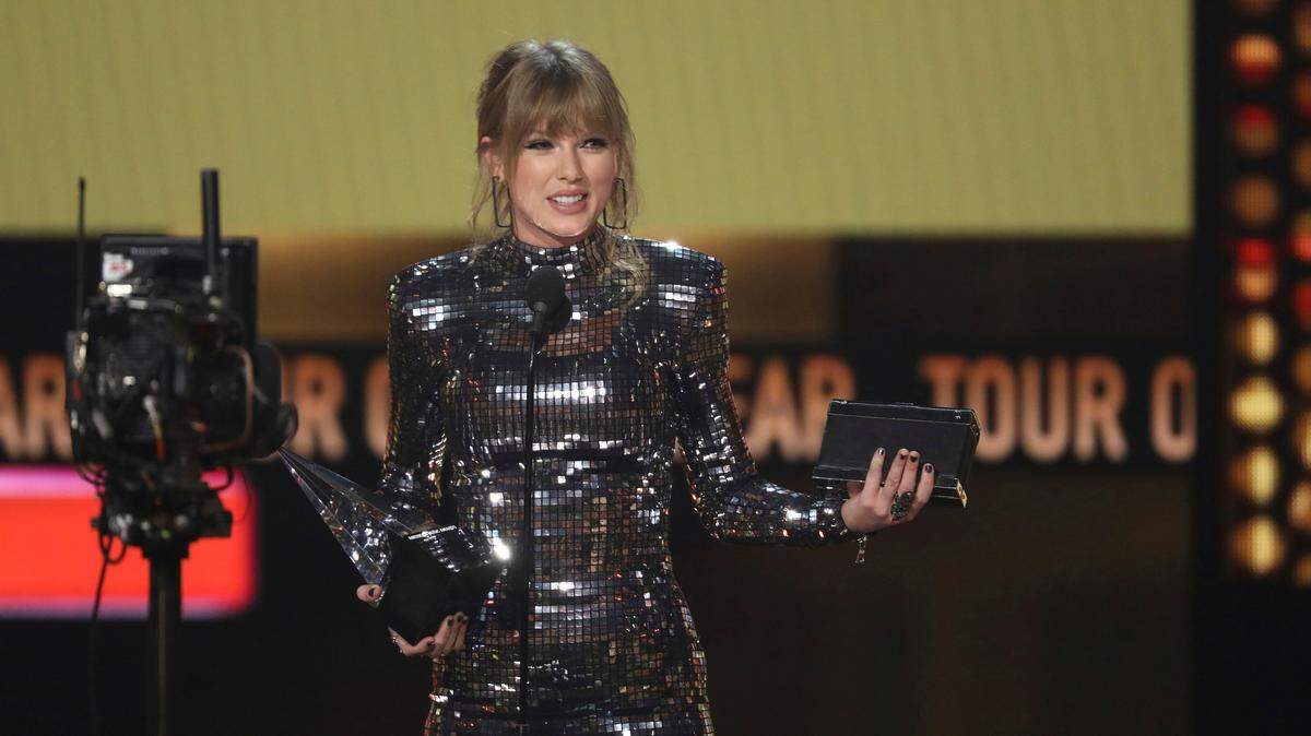 FILE - In this Oct. 9, 2018 file photo, Taylor Swift accepts the award for tour of the year at the American Music Awards at the Microsoft Theater in Los Angeles. (Matt Sayles/Invision/AP, File)