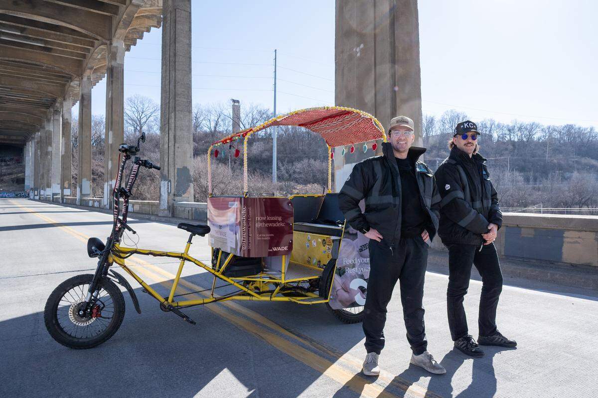 Mark Madden and Atticus Sloan, owners of E-Z Pedicabs, Kansas City's only ride-share pedicab service, on Monday, February 9. Sloan and Madden started their business nnearly two years ago after becoming inspired while visiting other cities that offered a similar service. The duo anticipates their services being at a premium for visitors in town for the World Cup.