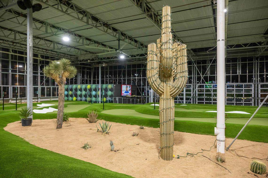 Housed inside a greenhouse, patrons can play mini golf indoors at Tap-Ins at the Greenhouse, a new restaurant/mini golf concept in Overland Park, on Wednesday, December 3, 2025.