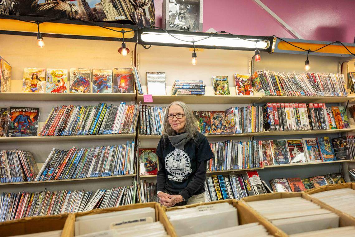 Sharon Farris, owner of Clint’s Comics, in Independence on Tuesday, January 7, 2026. Clint’s Comics was previously located in Midtown Kansas City before the ceiling collapsed on the building it occupied. Farris says selling comics and books ‘gives her purpose’ and is excited to have people back in her shop.