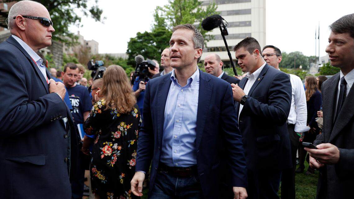 Missouri Gov. Eric Greitens walks past a group of supporters on Thursday, May 17, 2018, in Jefferson City, Mo.