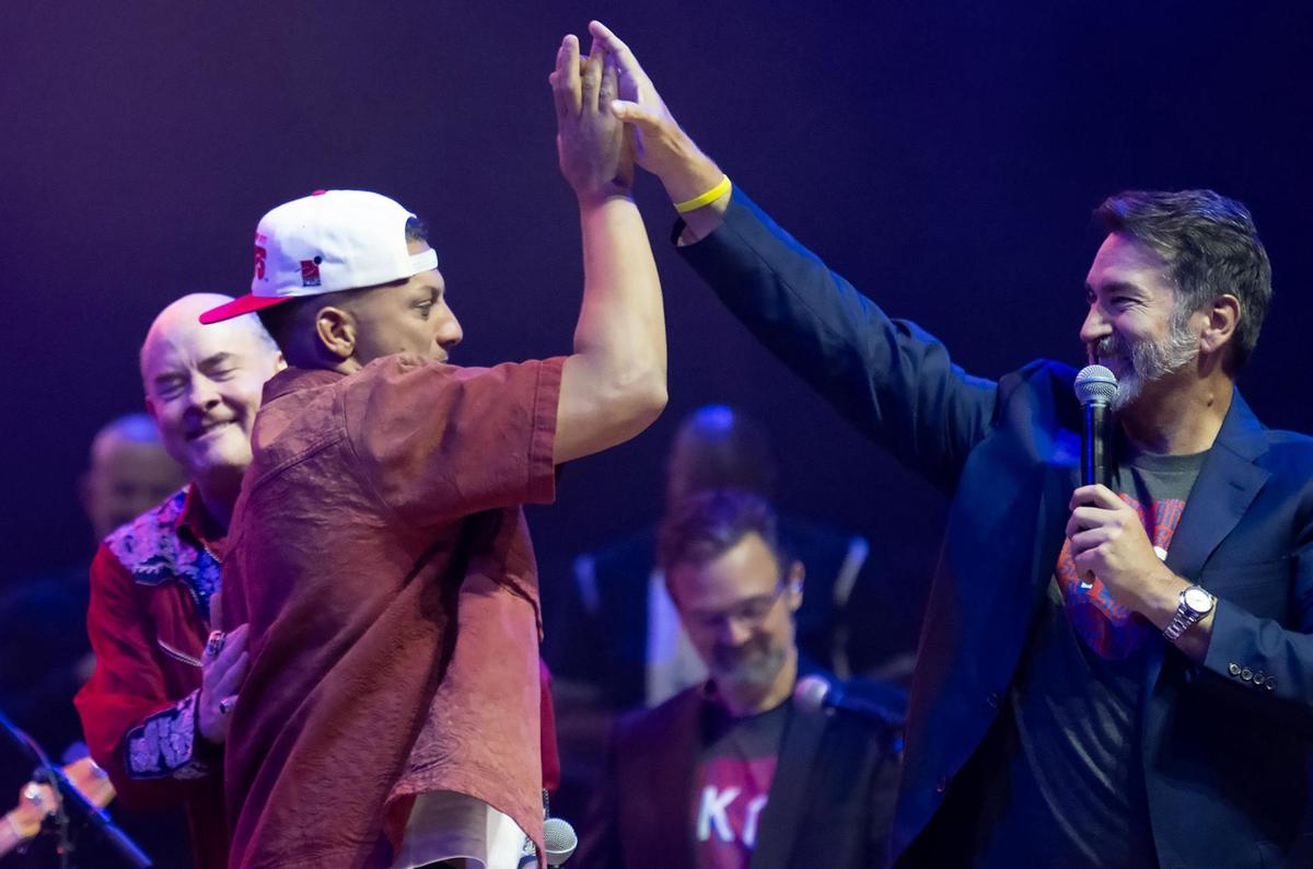 Chiefs quarterback Patrick Mahomes high-fives Rob Riggle at the Big Slick Show on Saturday, May 31, 2025, at the T-Mobile Center in Kansas City.