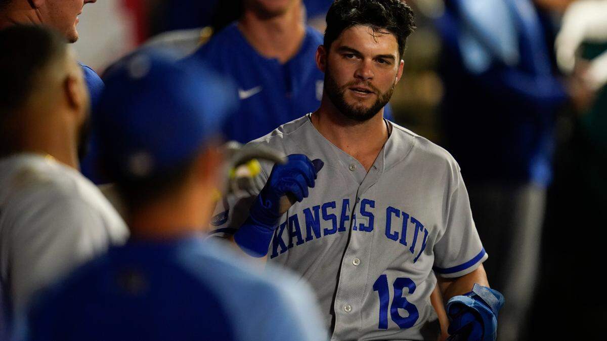 Kansas City Royals left fielder Andrew Benintendi (16) returns to the dugout after scoring during a baseball game against the Los Angeles Angels in Anaheim, Calif., Tuesday, June 21, 2022. (AP Photo/Ashley Landis)