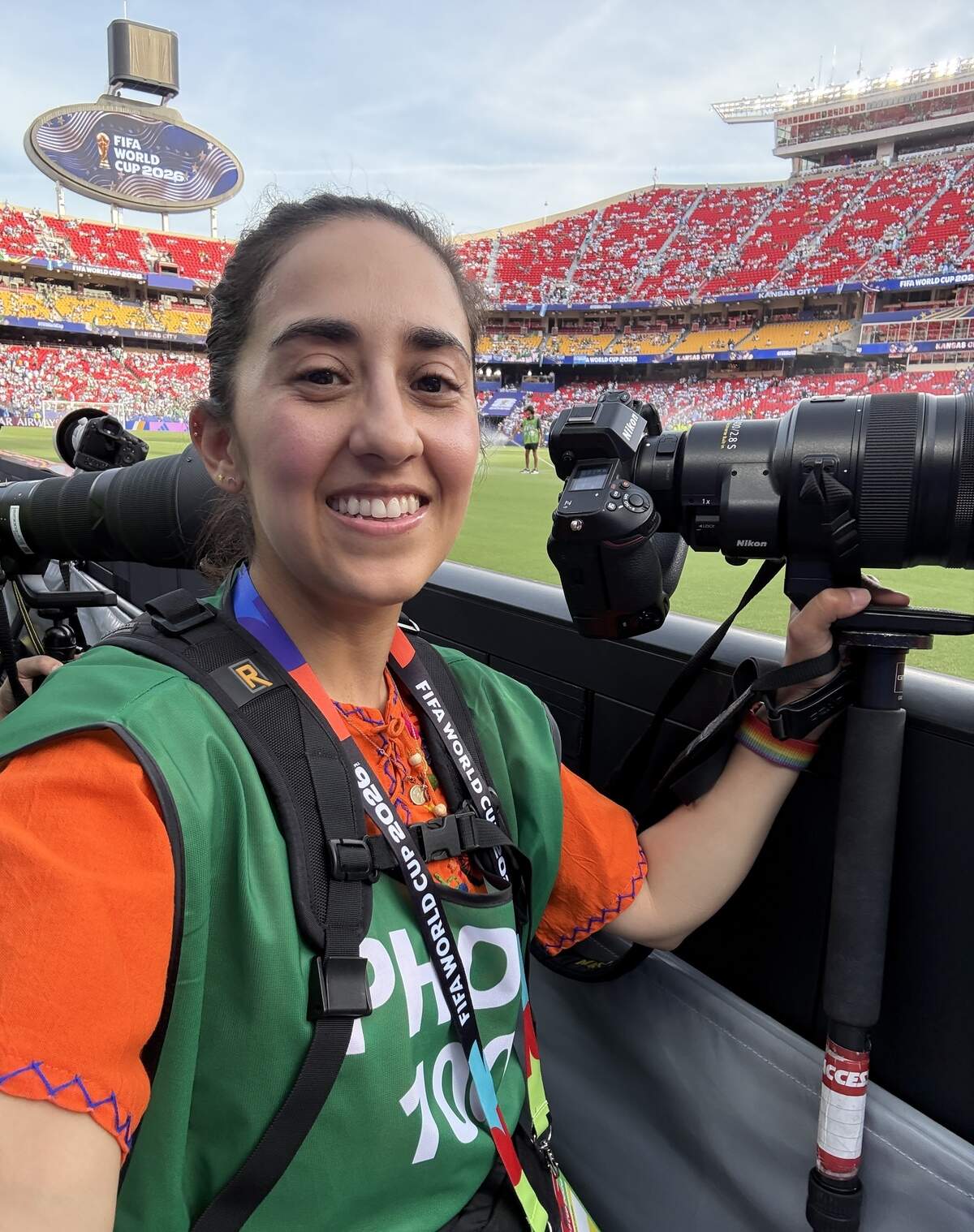 Kansas City Star photojournalist Emily Curiel on the field at Kansas City (Arrowhead) Stadium at the World Cup.