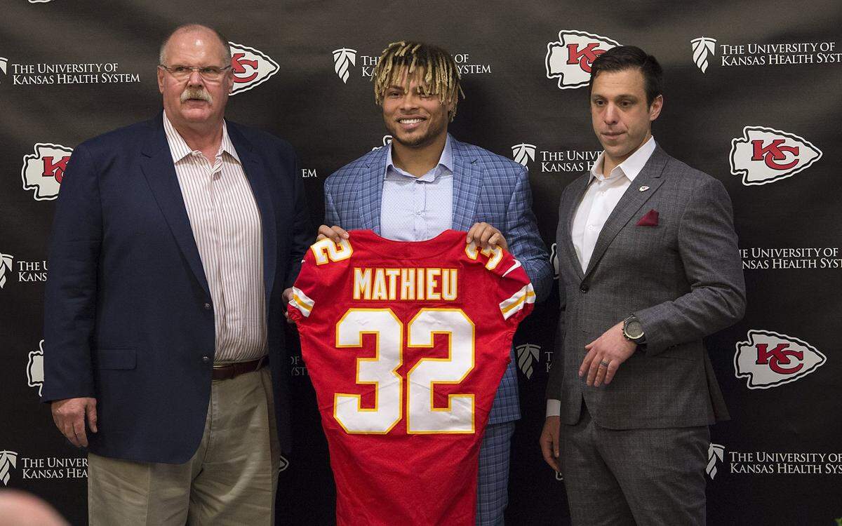 Chiefs coach Andy Reid, left, and general manager Brett Veach flank newly signed safety Tyrann Mathieu on March 14, 2019 in Kansas City.