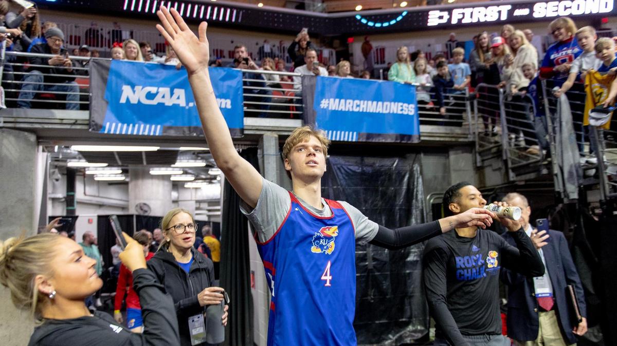 Kansas guard Gradey Dick reaches out to high-five fans before a team shootaround Wednesday. The Jayhawks’ first-round NCAA tourney game is against Howard on Thursday in Des Moines, Iowa.