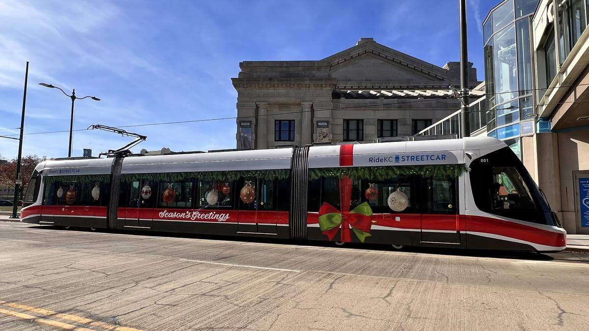 The decorated Holiday Streetcar stops at Union Station before carrying passengers north to the River Market area of Kansas City. Riders can expect musical performances aboard the streetcar this holiday season.