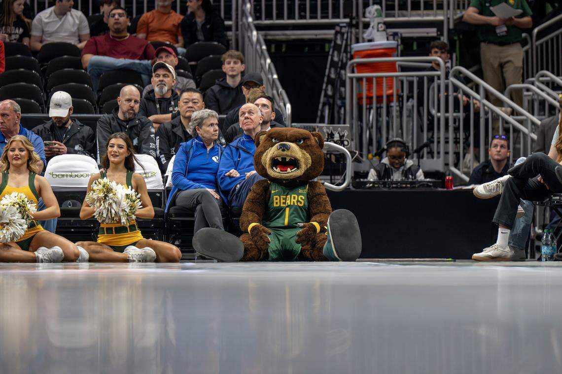 The Baylor mascot sits courtside next to cheerleaders during a Big 12 Men's Basketball Tournament game between Baylor and Arizona State at T-Mobile Center on Tuesday, March 10, 2026, in Kansas City.