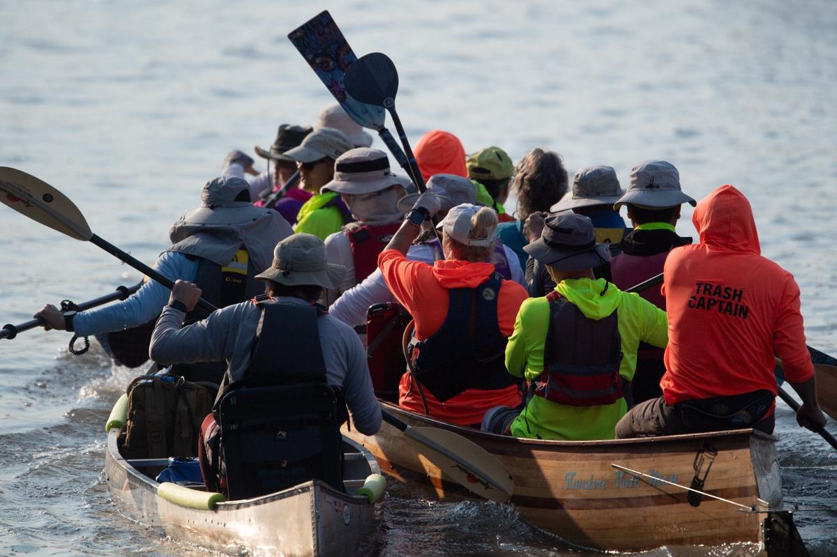 The Paddle Stop New Haven team collides with another team at the start of the race.