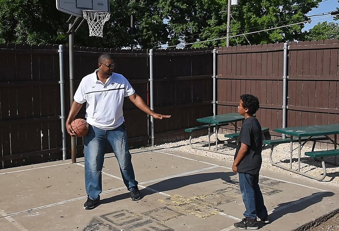 Former Kansas State big man, Luis Colon (left) has found happiness by helping others. He works at Sheffield place, east of downtown. Jalin (right) is one of the kids Colon has been spending time with and helping. To be “able to be that inspiration that I was always looking for as a child … it really fills me with joy,” said Colon. “I feel like I kind of save lives sometimes."