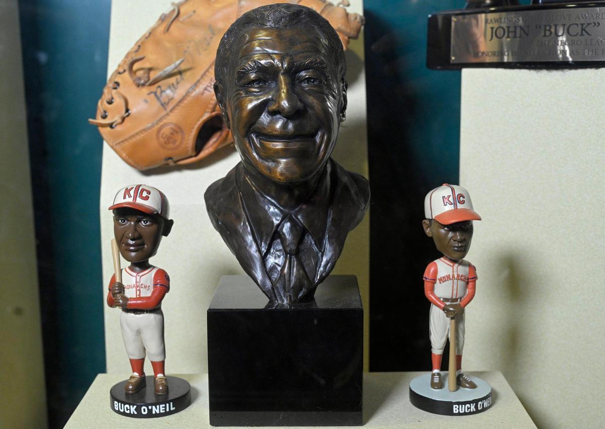 A bust and two bobbleheads of Buck O’Neil at the Negro Leagues Baseball Museum. O’Neil helped make the Negro Leagues famous again before he was passed over for the Hall of Fame in 2006.