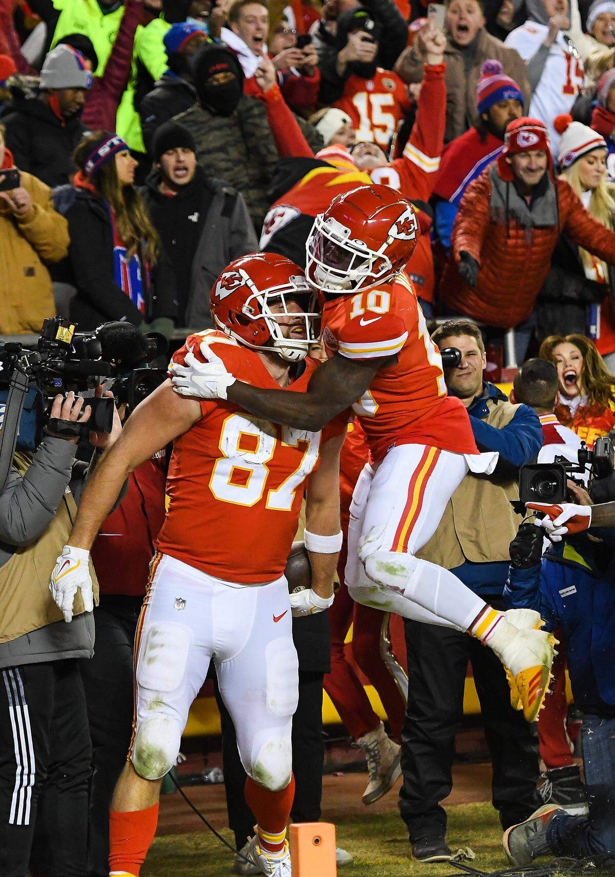Kansas City Chiefs wide receiver Tyreek Hill celebrates tight end Travis Kelce's game-winning touchdown in overtime of the AFC Divisional Playoff game between the Chiefs and the Buffalo Bills at GEHA Field at Arrowhead Stadium on January 23, 2022. The Chiefs beat the Bills 42-36.